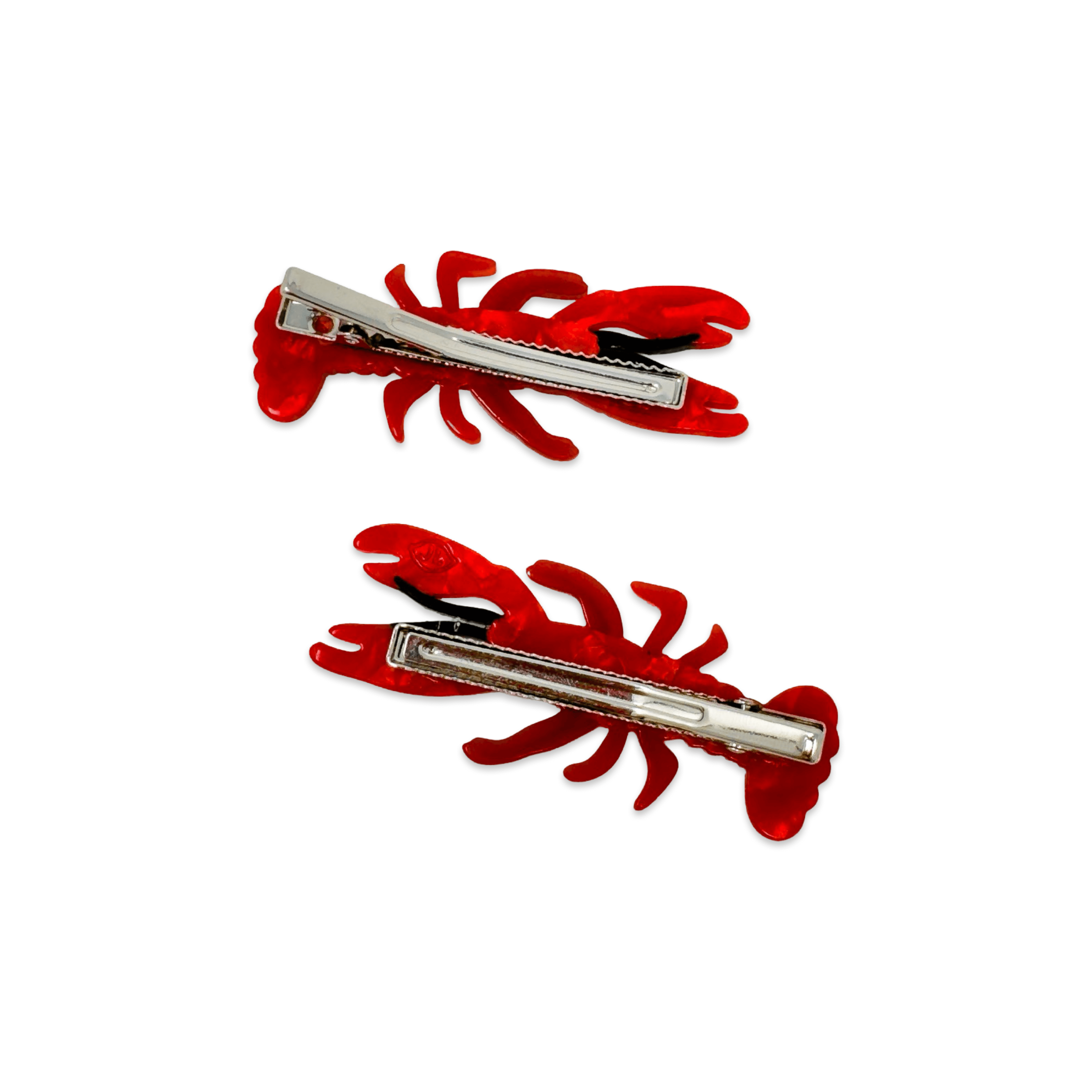 Back of two red lobster-shaped hair clips on a white background