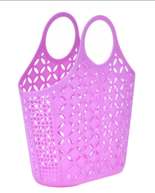 Purple plastic basket with two oval top handles and an all-over cutout geometric pattern, shown on a plain white background.