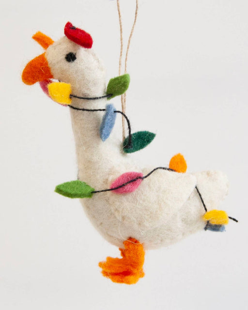 A white felt Christmas ornament shaped like a duck, decorated with colorful felt holiday lights in green, blue, pink, yellow, and orange, hanging against a plain white background.