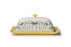 Decorative butter dish with floral patterns and the word 'BUTTER' on a white background