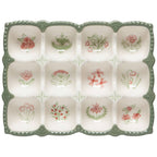 Decorative ceramic egg tray with floral patterns on a white background