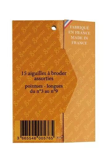 Back of packaging of sewing needles with text on a white background
