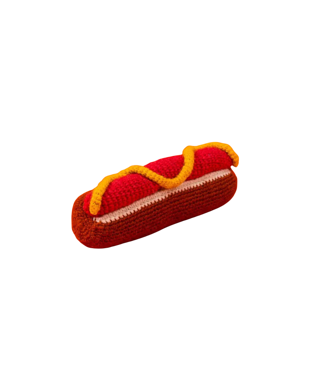 Knitted hot dog dog toy with red bun and yellow mustard on a white background