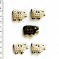 Four white sheep and one black sheep buttons on a white background
