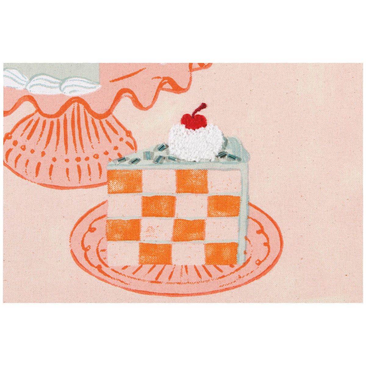 Checkered cake with whipped cream and a cherry on top on a pink background