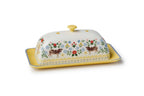 Decorative ceramic butter dish with cow and floral design on a white background