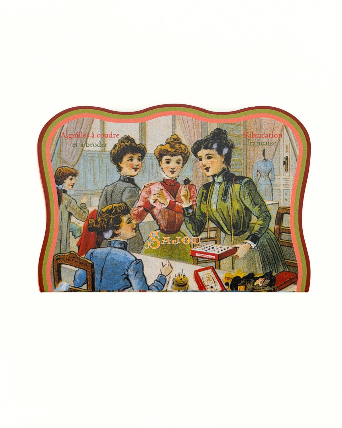 Vintage-style illustration of women at a table with sewing materials on a sewing needle package.