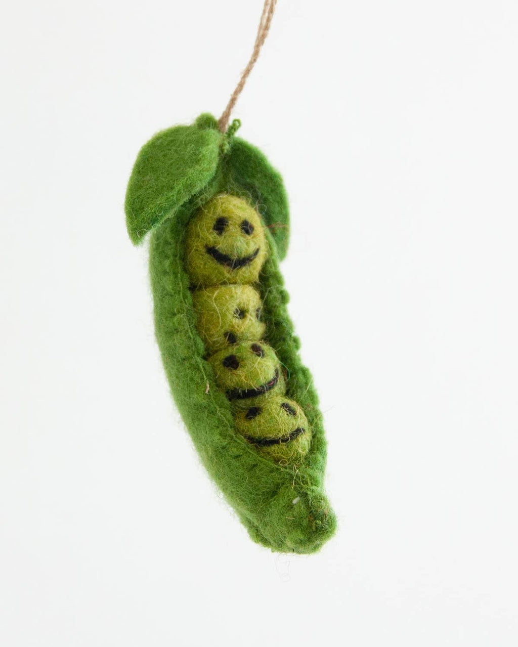 Decorative green pea pod with a smiling face on a white background