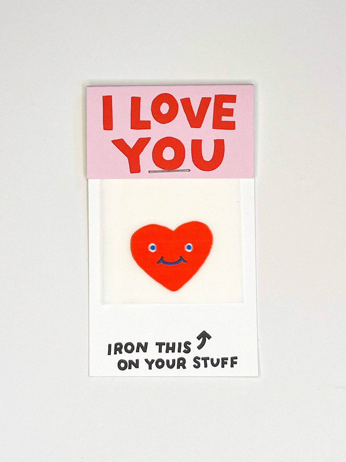 Iron-on patch with a red design on a white background