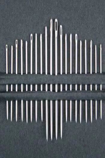 Up close of 20 needle set on a black background