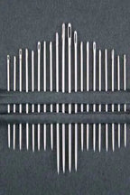 Up close of 20 needle set on a black background