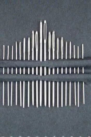 Up close of 20 needle set on a black background