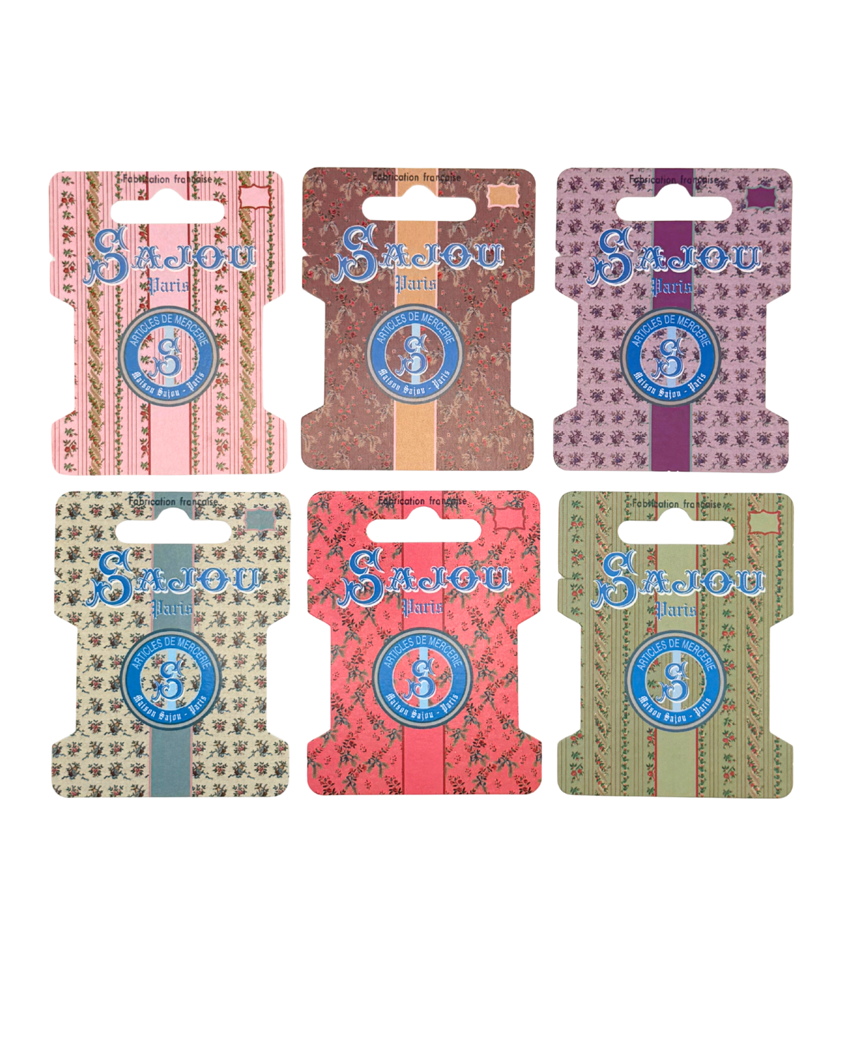 Set of six Sajou brand thread storage on a white background