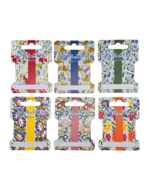 Set of six floral-patterned thread storage on on a white background