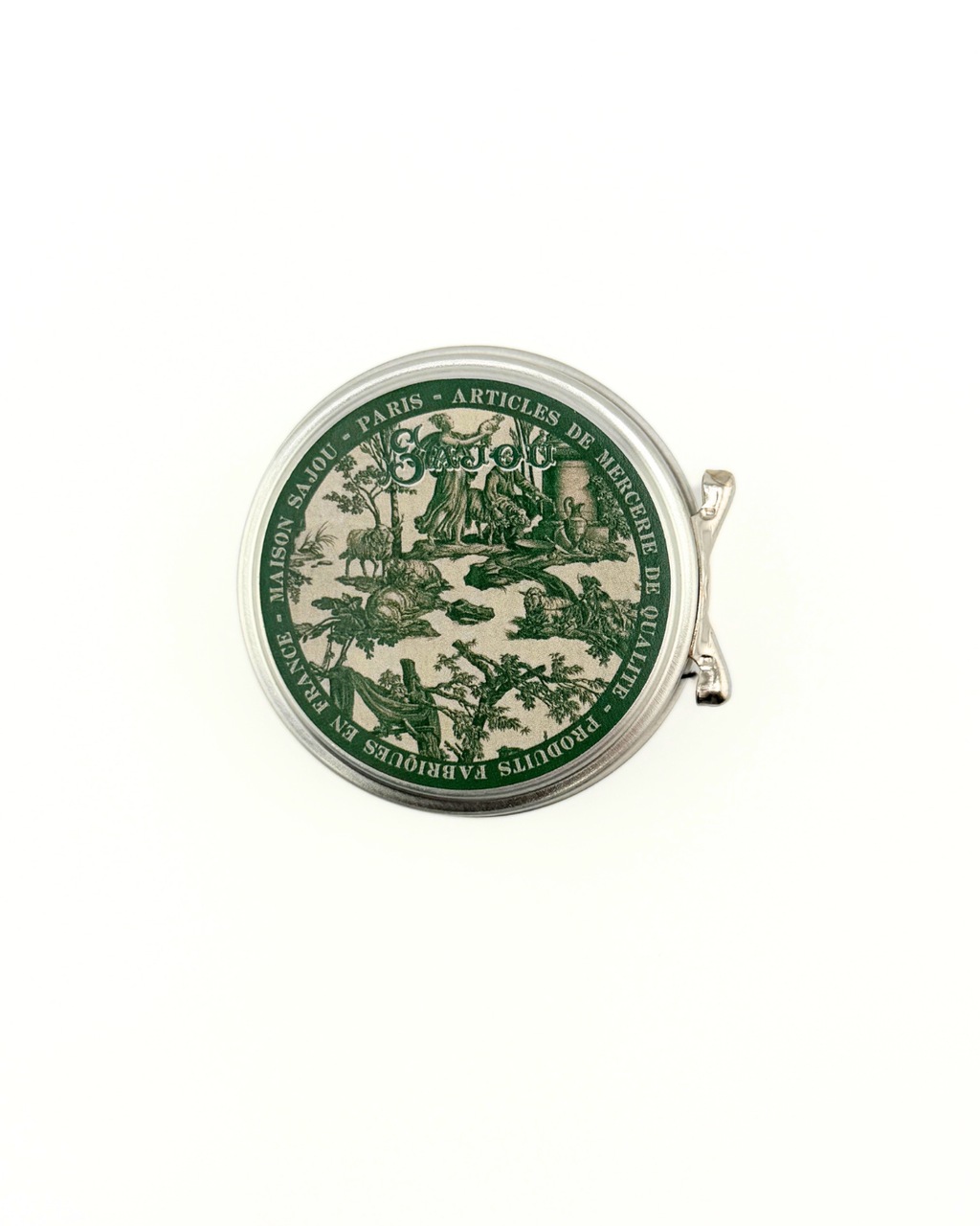 Round green and beige tin with decorative design on a white background