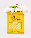 Yellow "pasta" vase with flowers on a white background