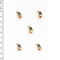 Five tiny geese-shaped buttons on a white background with a ruler for scale.