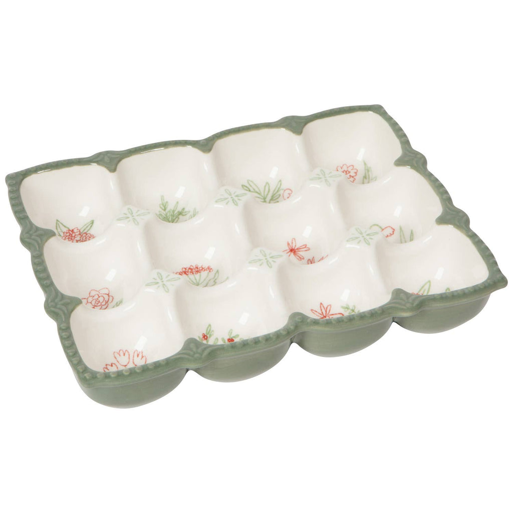 Ceramic egg tray with floral design on a white background