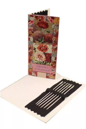 Floral-patterned needle booklet with a black holder on a white background