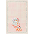 Tea towel with cake illustration on a pink background
