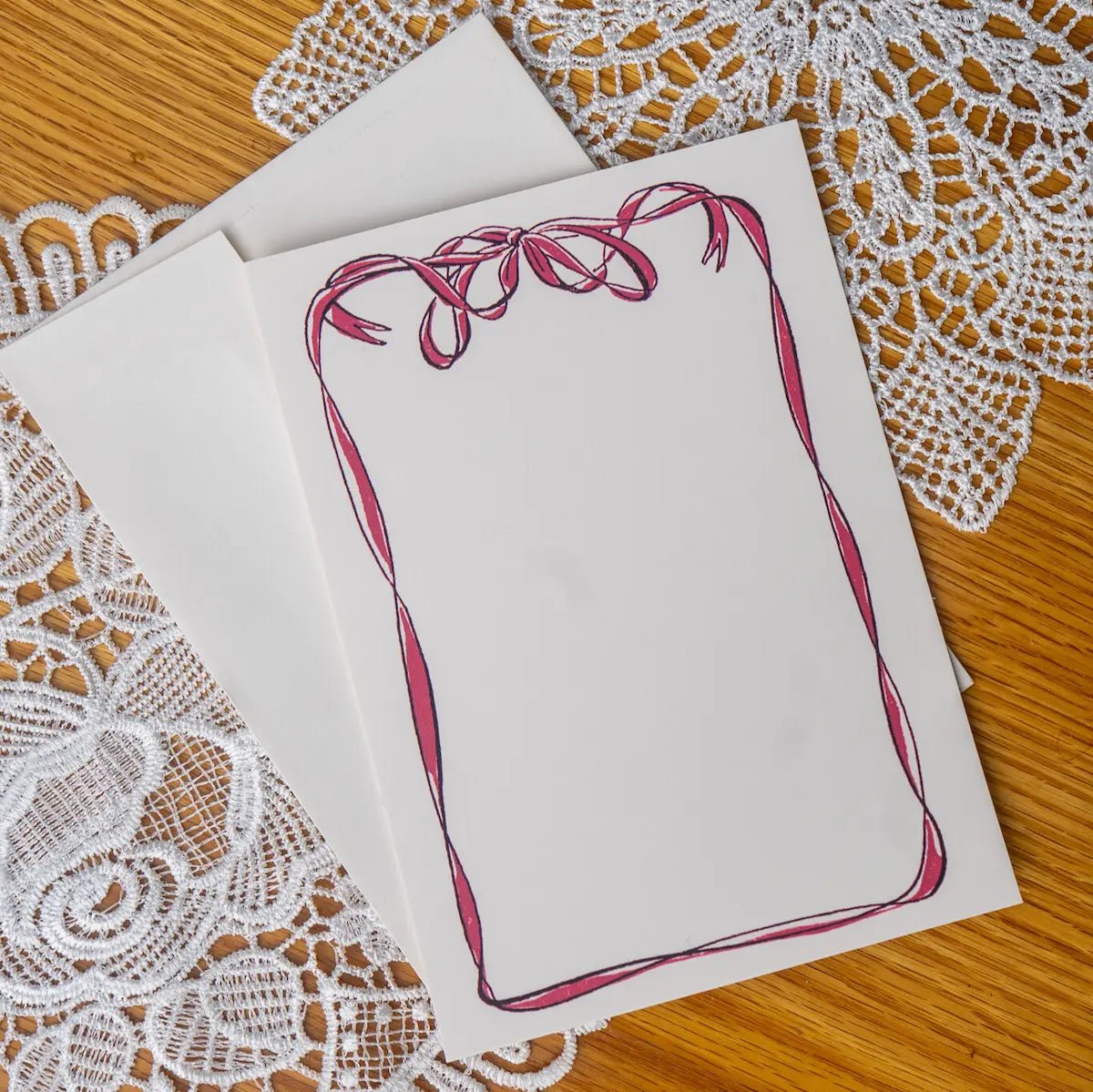 Bow card on a doily background 