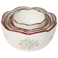 Set of four ceramic nesting bowls with floral design on a white background