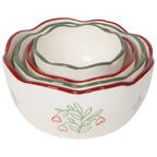 Set of four ceramic nesting bowls with floral design on a white background