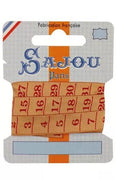 Red and orange Sajou measuring tape ribbon with brand label on a white background