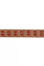 Red measurement tape ribbon with numbers on a white background