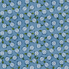 Pattern of white flowers with green leaves on a blue background