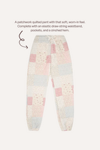 Patchwork quilted lounge pants with a soft, worn-in feel, featuring a mix of pink, red, blue, and beige gingham, floral, and checkered fabric squares. The pants are shown with a white elastic drawstring waistband and side pockets, set against a light beige background with descriptive text at the top.