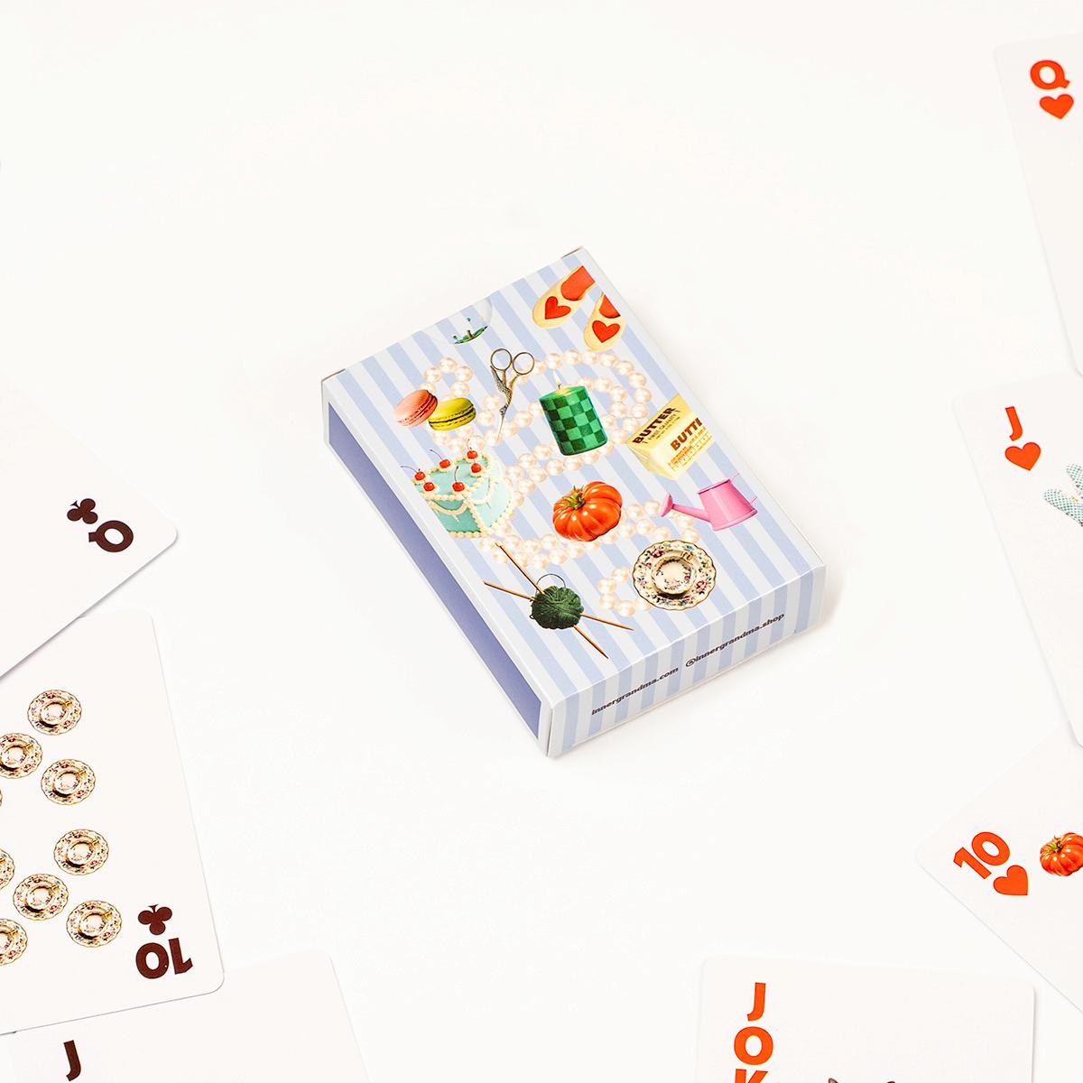 Playing card box with decorative illustrations on a white background