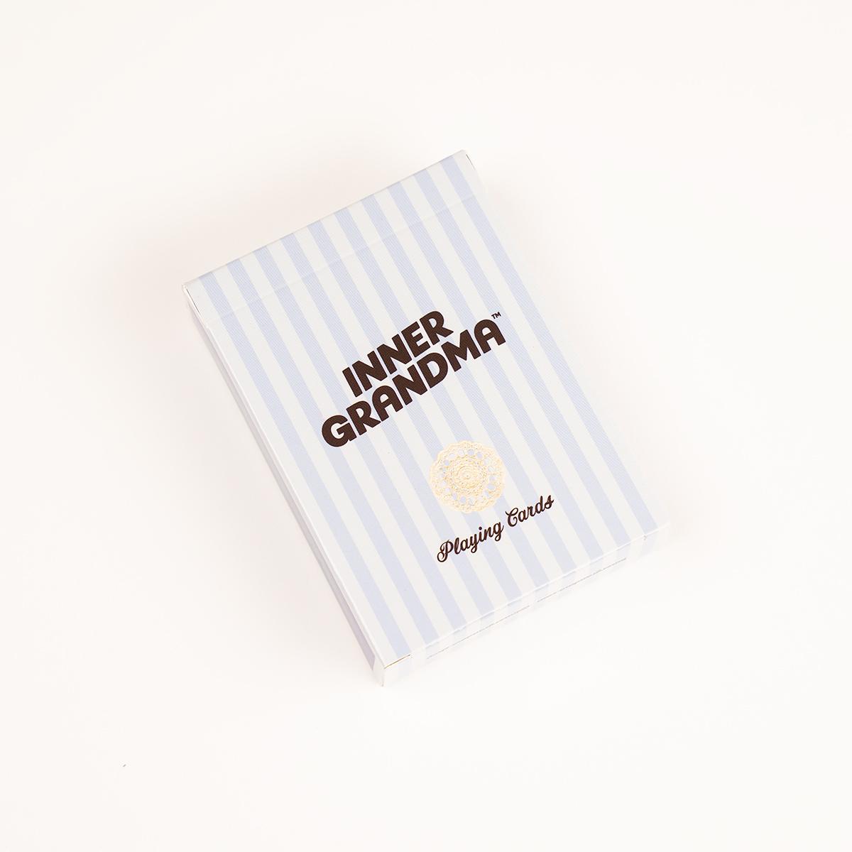 Playing card deck with 'Inner Grandma' text on a striped cover