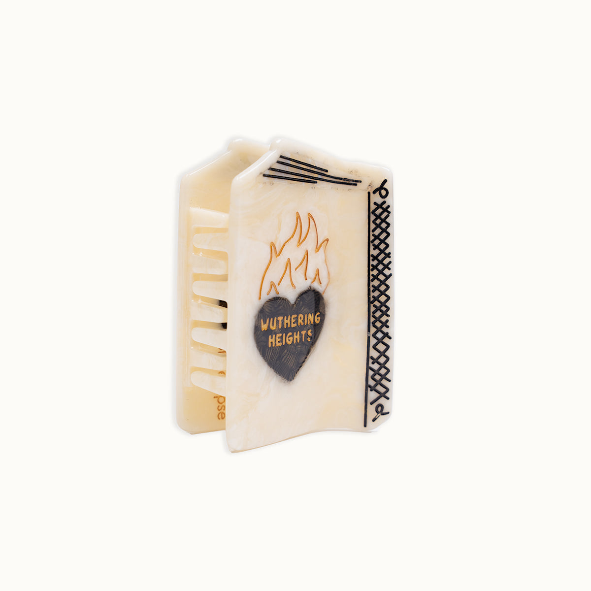 Miniature book with 'Wuthering Heights' design on a white background