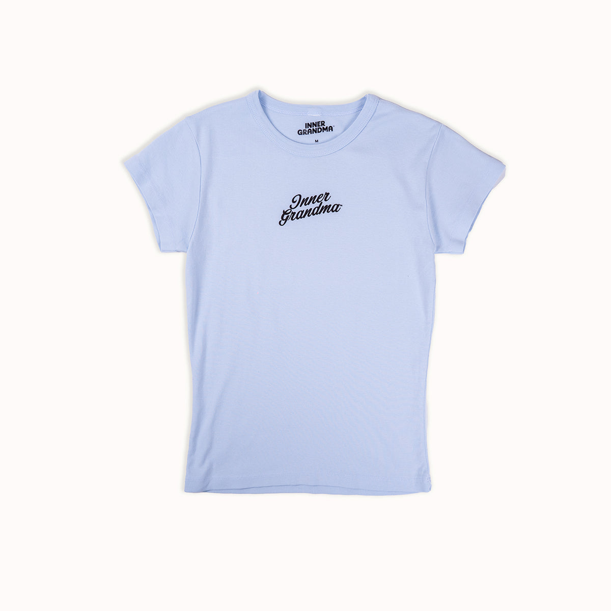 Light blue cropped baby t-shirt with 'Inner Grandma' text on a white background