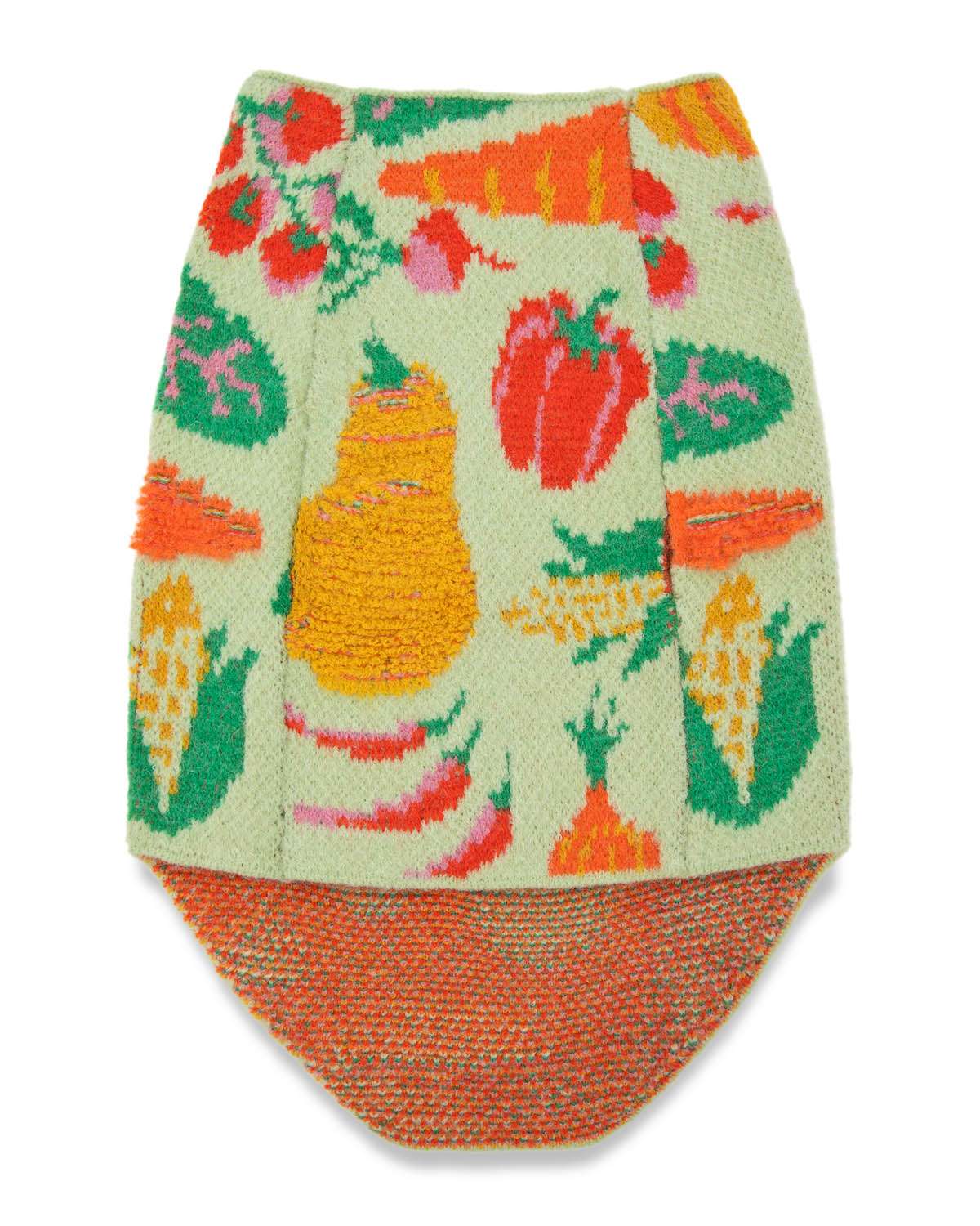 Bottom of knitted dog sweater with colorful vegetable pattern on a white background