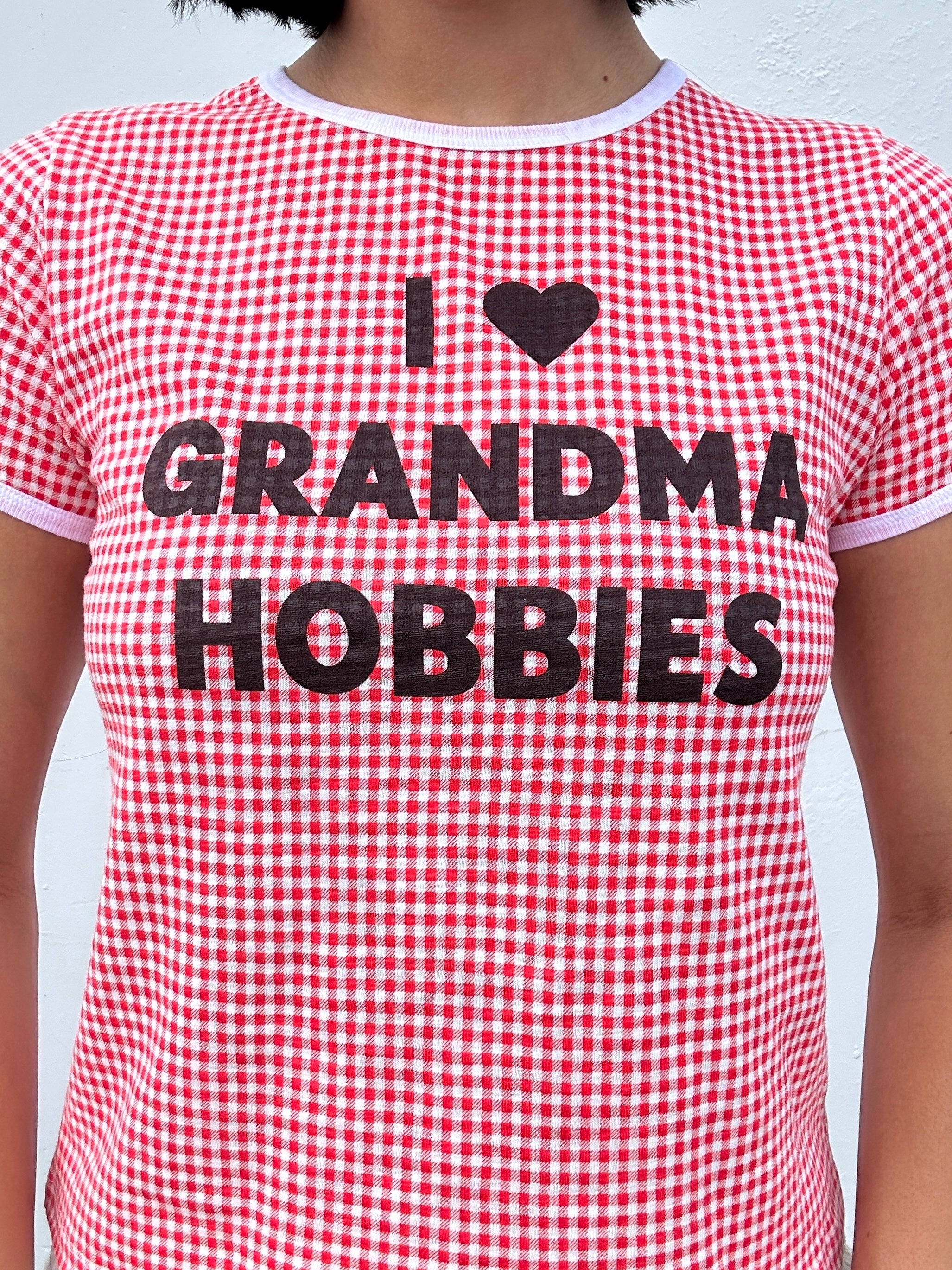 Red and white checkered t-shirt with 'I ❤️ Grandma Hobbies' text.
