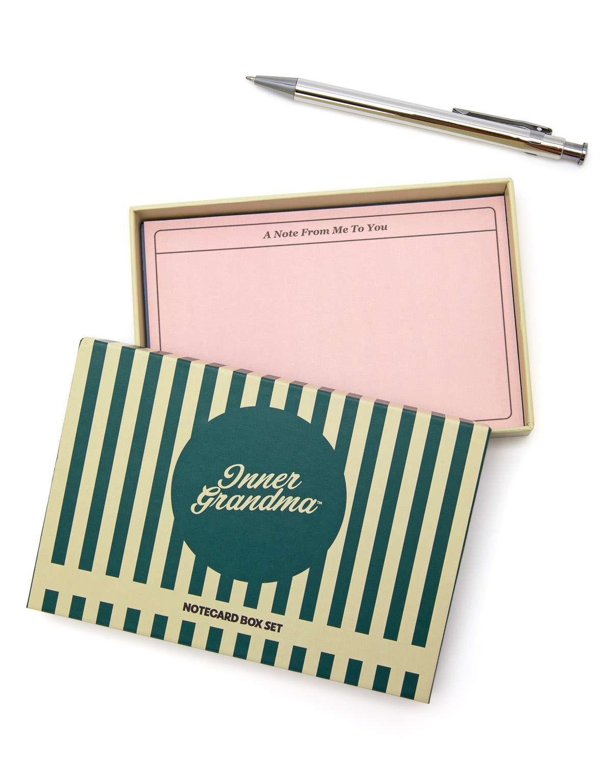 Notecard box set with striped design and pink interior on a white background