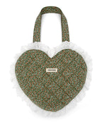 Rather be Reading green heart-shaped bag with quilted floral pattern and white ruffle on a white eyelet ruffle