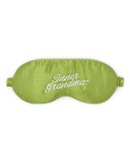 Green sleep mask with 'Inner Grandma' embroidered text on a white background