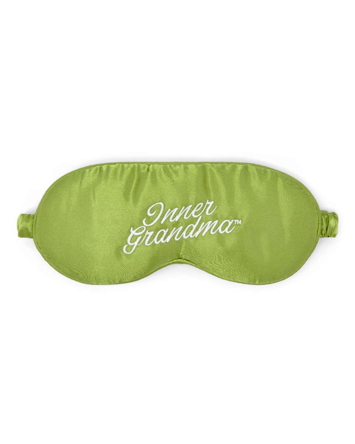 Green sleep mask with 'Inner Grandma' embroidered text on a white background
