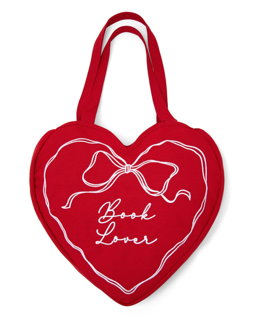 Red heart-shaped bag with 'Book Lover' text and bow design on a white background