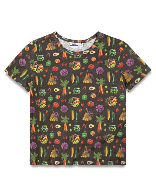 A short-sleeve dark charcoal colored t-shirt featuring an all-over vegetable print. The pattern includes various illustrated vegetables like carrots, broccoli, tomatoes, and avocados in bright colors.