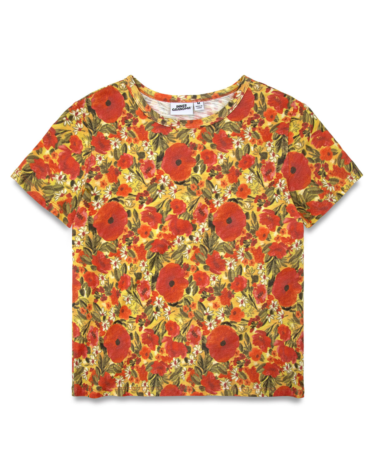 A short-sleeve crewneck t-shirt featuring an all-over floral print with red poppies, yellow flowers, and green leaves on a warm yellow background.