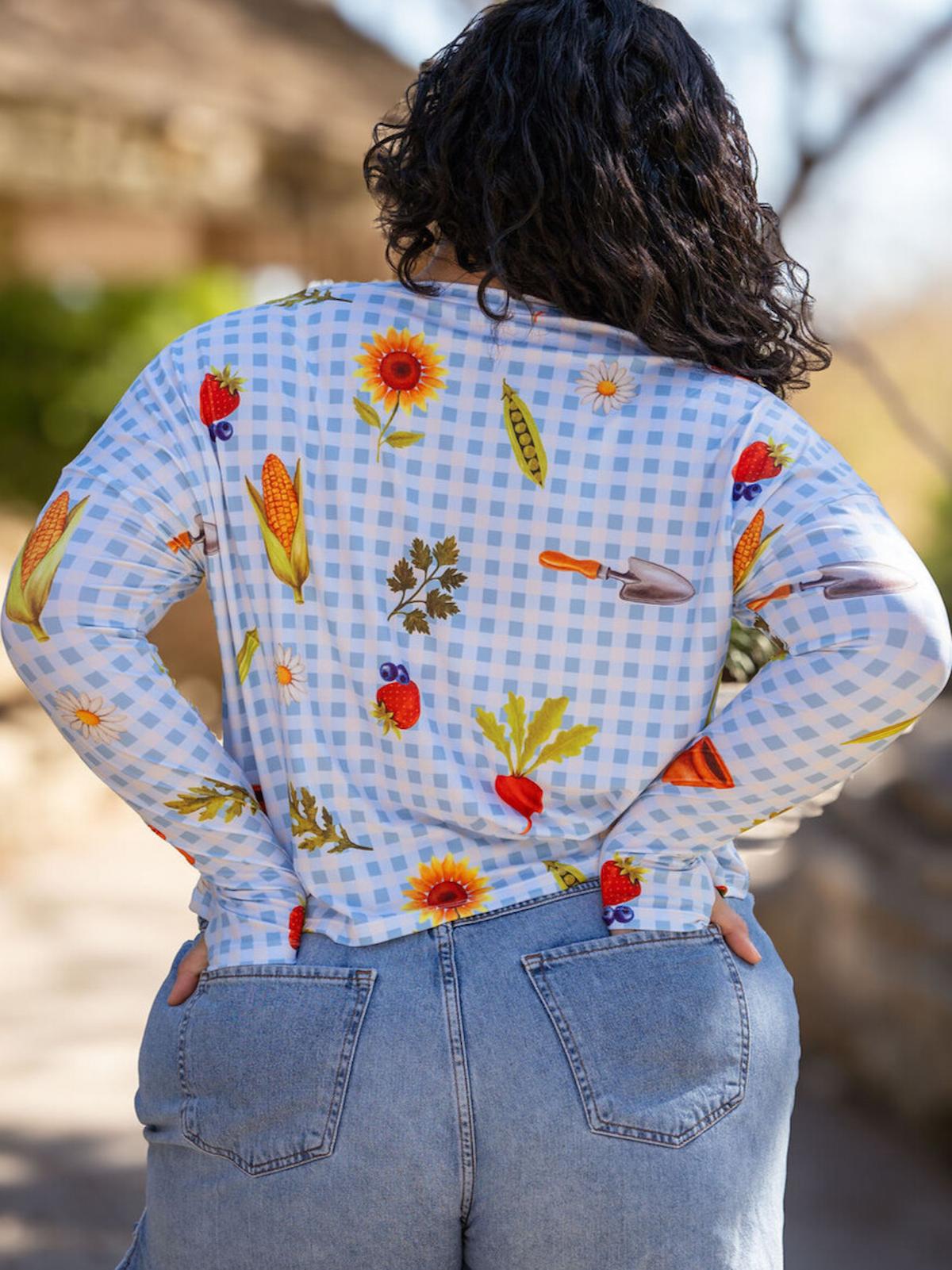 Person wearing a colorful patterned shirt with a checkered background
