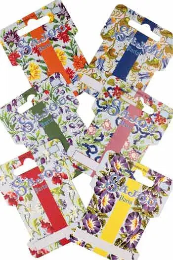 Set of floral colorful thread/ ribbon storage cards on a white background