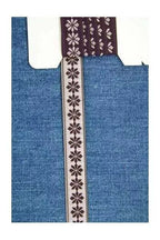Blue fabric with a decorative purple and white pattern on a white background