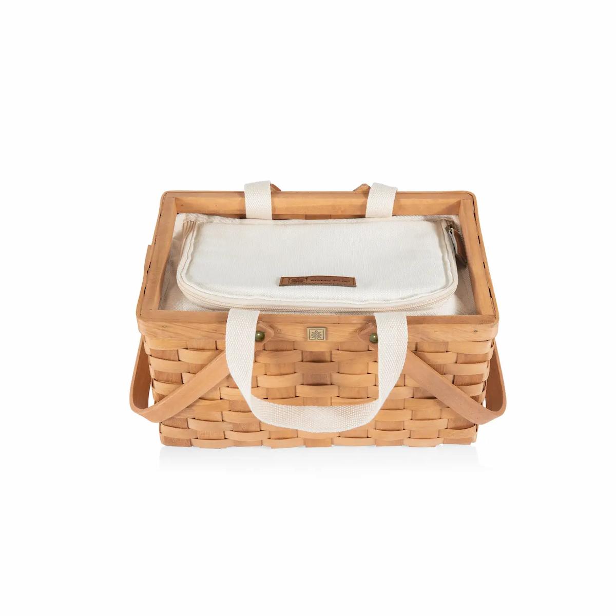 Wicker picnic basket with white interior on a white background
