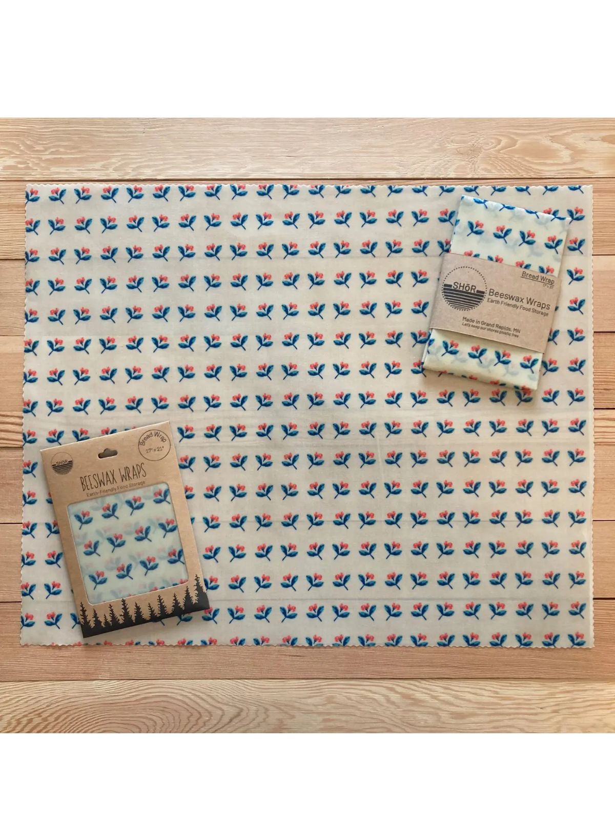 Patterned blanket with a tag on a wooden surface