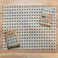 Beeswax wrap with floral pattern on a wooden surface